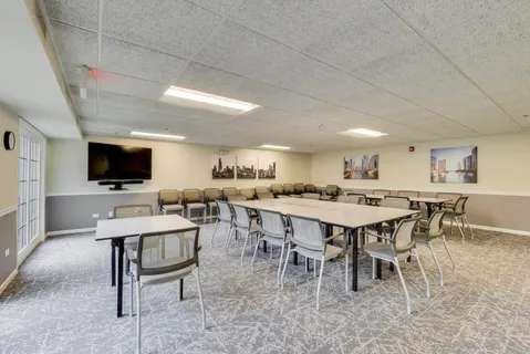 a dining room with furniture and window
