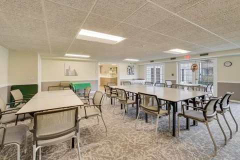 a kitchen with stainless steel appliances a refrigerator sink and white cabinets
