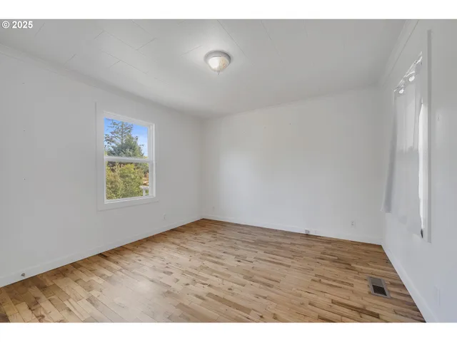 a bathroom with a sink mirror and shower