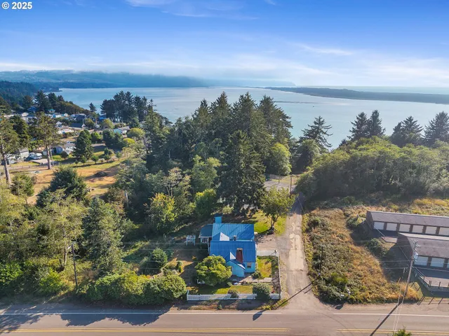 a view of a house with a yard and garage