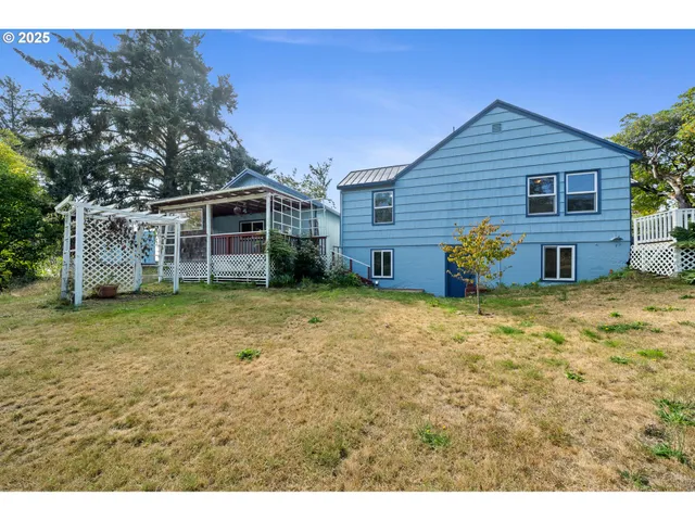 a view of wooden house and a yard