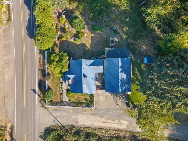 a view of a yard with wooden fence