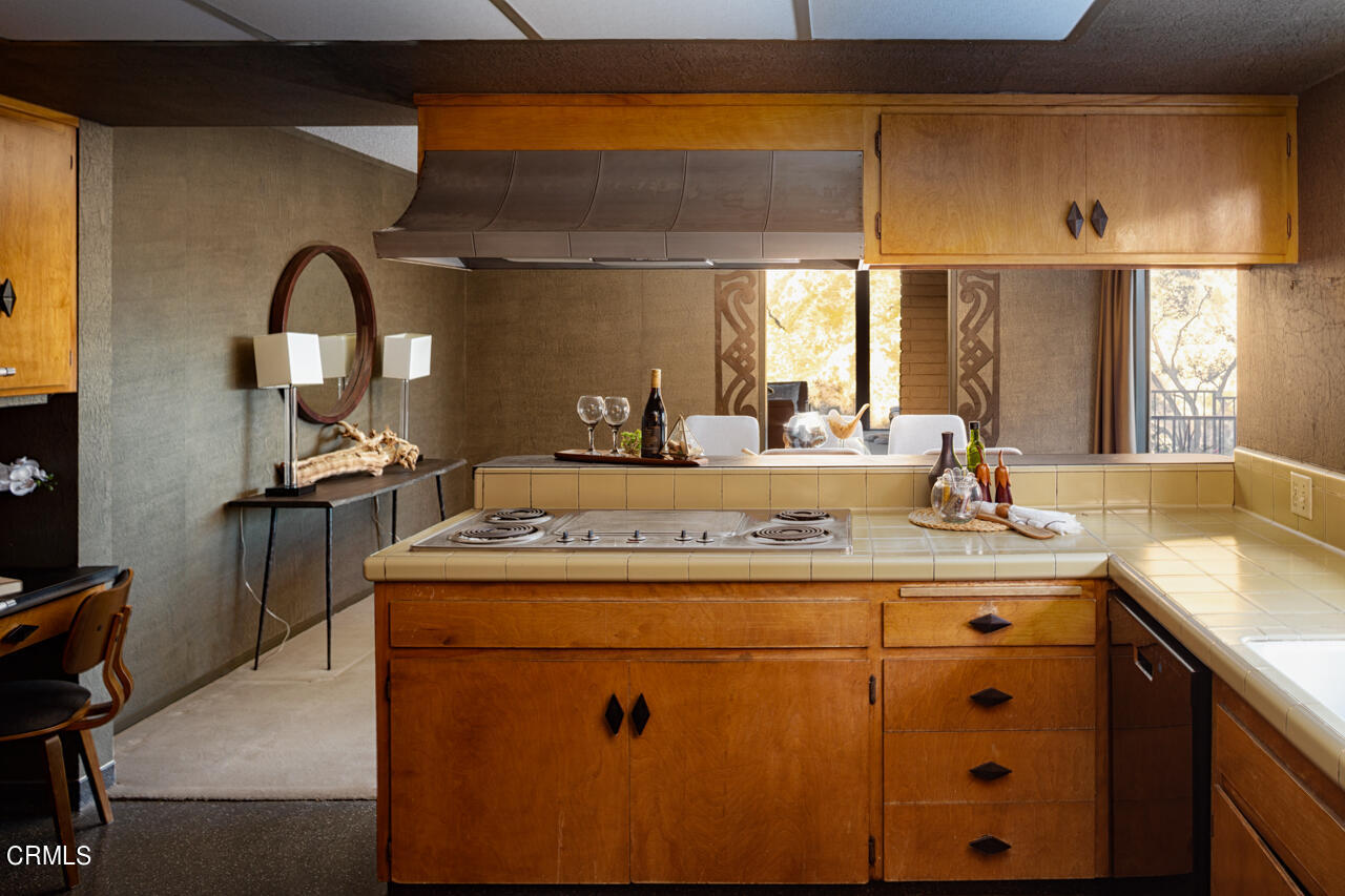 2207 Pinecrest Drive Altadena, CA 91001 - Photo 12 of 43 a kitchen with kitchen island a stove a sink and a window