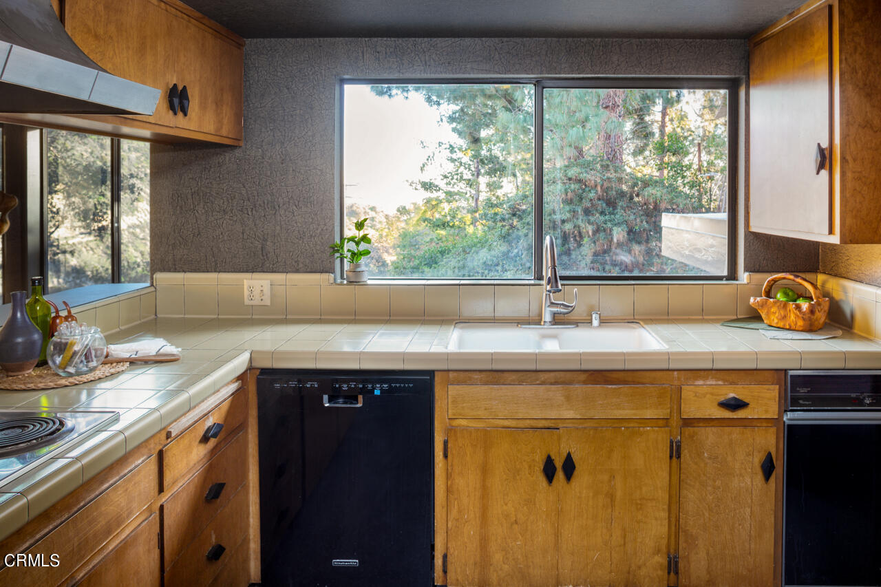 2207 Pinecrest Drive Altadena, CA 91001 - Photo 13 of 43 a kitchen with a sink and a window