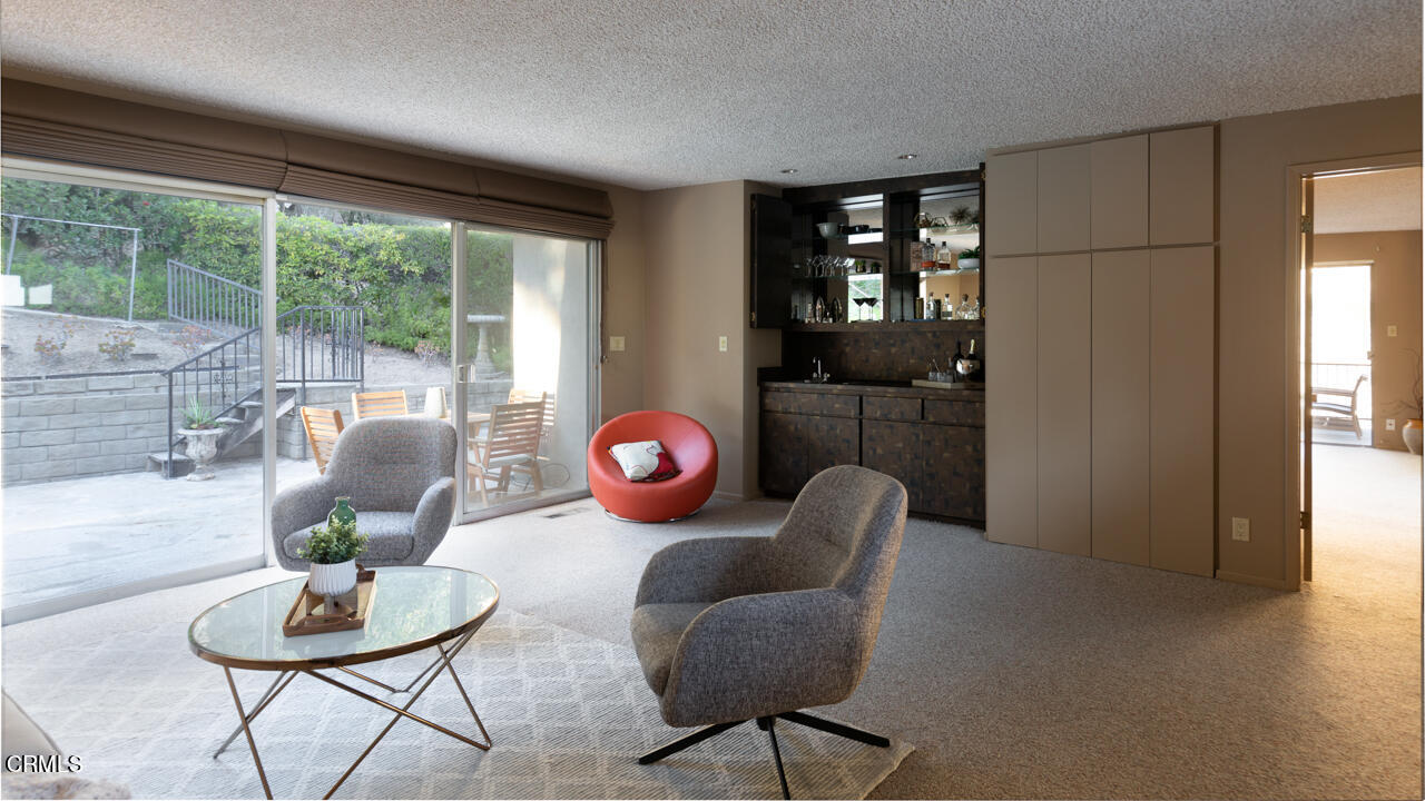 2207 Pinecrest Drive Altadena, CA 91001 - Photo 17 of 43 a living room with furniture and a floor to ceiling window