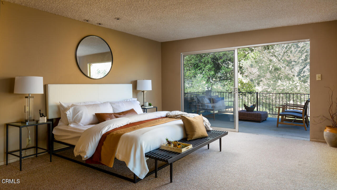 2207 Pinecrest Drive Altadena, CA 91001 - Photo 20 of 43 a bedroom with bed and a large window