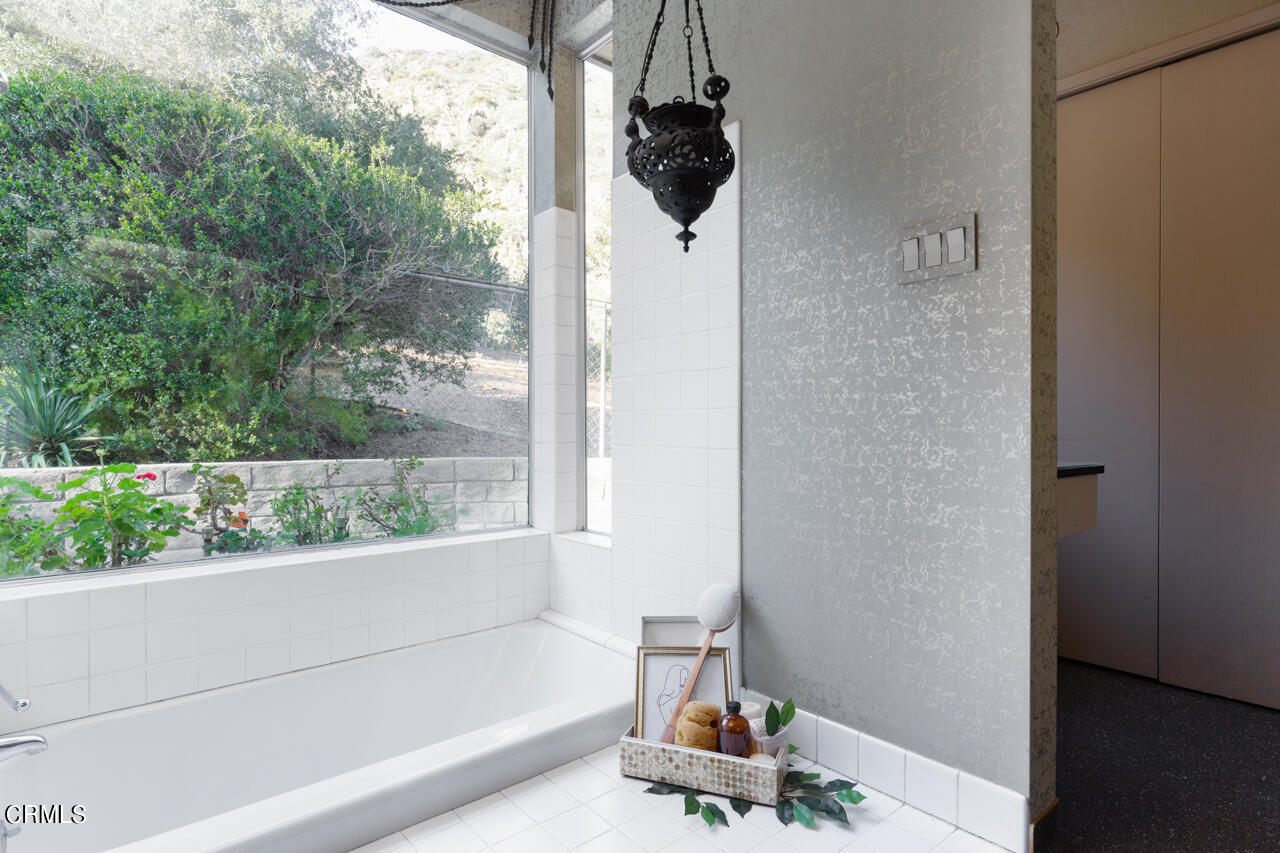 2207 Pinecrest Drive Altadena, CA 91001 - Photo 24 of 43 a bathroom with a bathtub and window