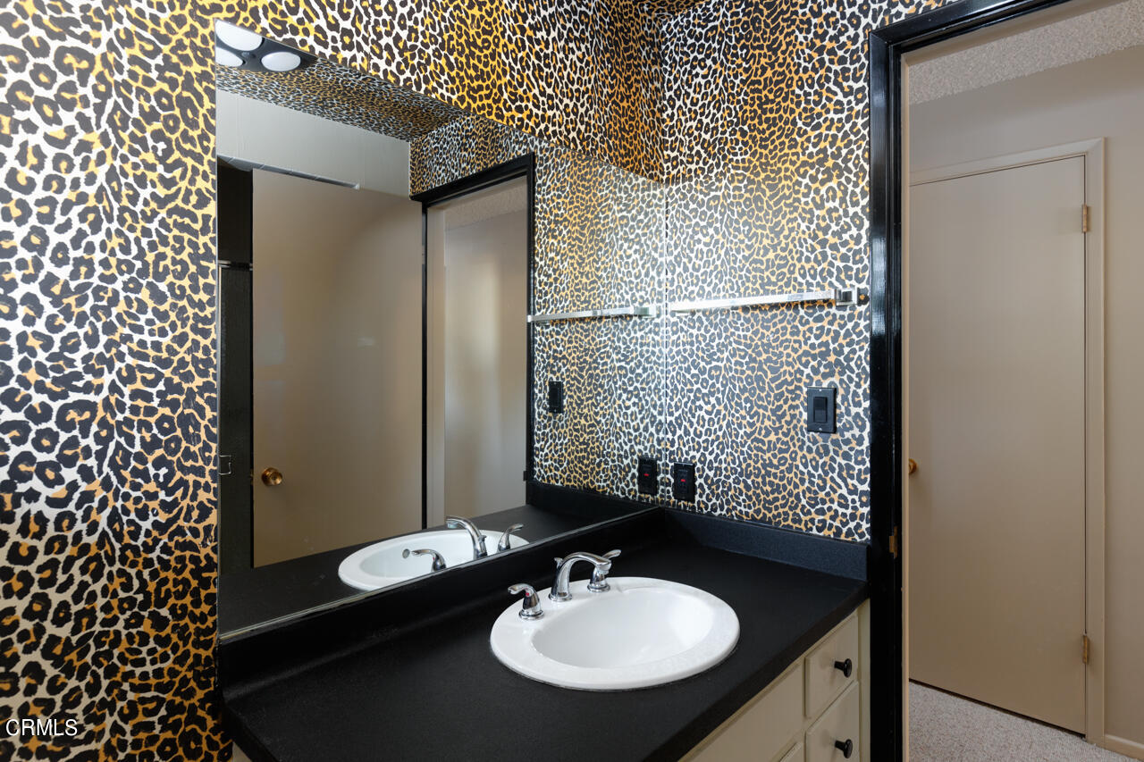 2207 Pinecrest Drive Altadena, CA 91001 - Photo 27 of 43 a bathroom with a sink and a mirror