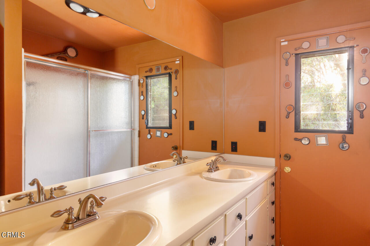 2207 Pinecrest Drive Altadena, CA 91001 - Photo 30 of 43 a bathroom with a sink and a mirror