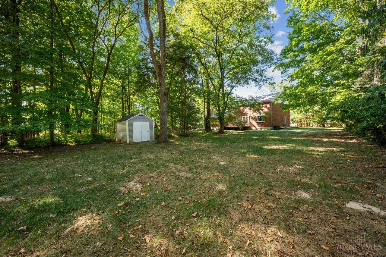 8589 Weller Road Montgomery, OH 45249 - Photo 28 of 30 A mix of wooded areas and a flat, level backyard. It includes a storage shed for gardening tools and a dedicated space that can serve as your own soccer field.