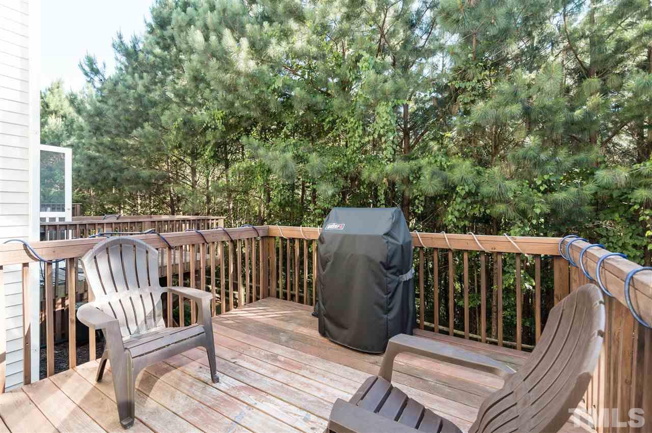 5406 Echo Ridge Road Raleigh, NC 27612 - Photo 22 of 25 a view of balcony with wooden floor and fence