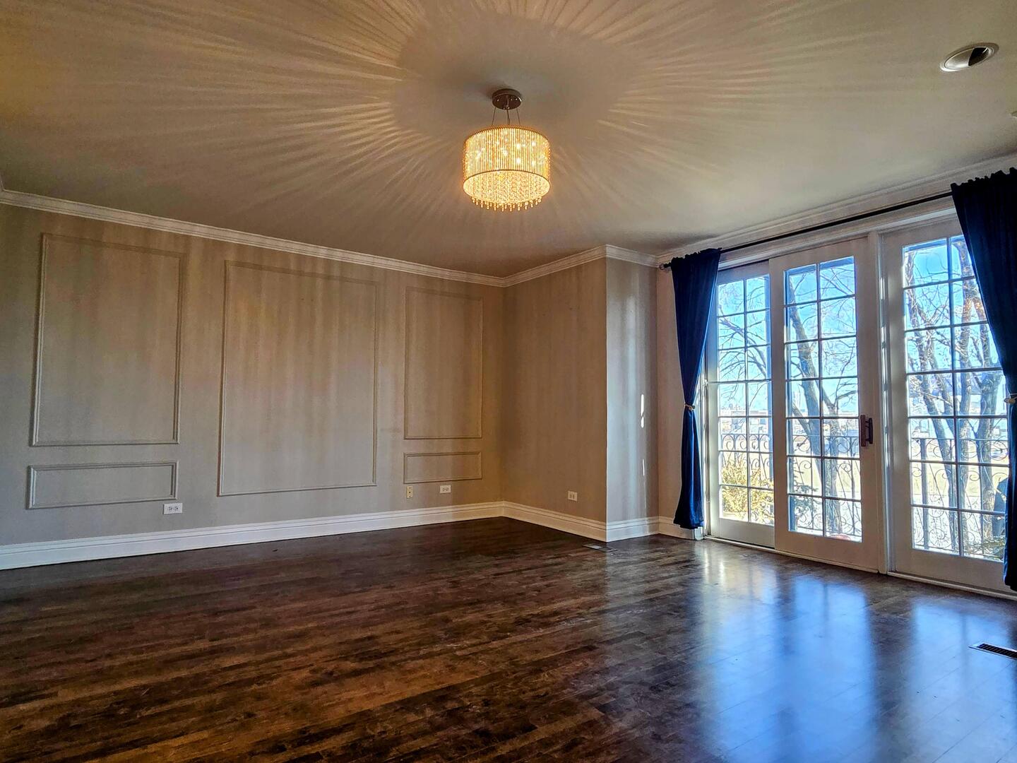1422 North Noble Street, Unit 2S Chicago, IL 60642 - Photo 3 of 15 a view of an empty room with window and wooden floor