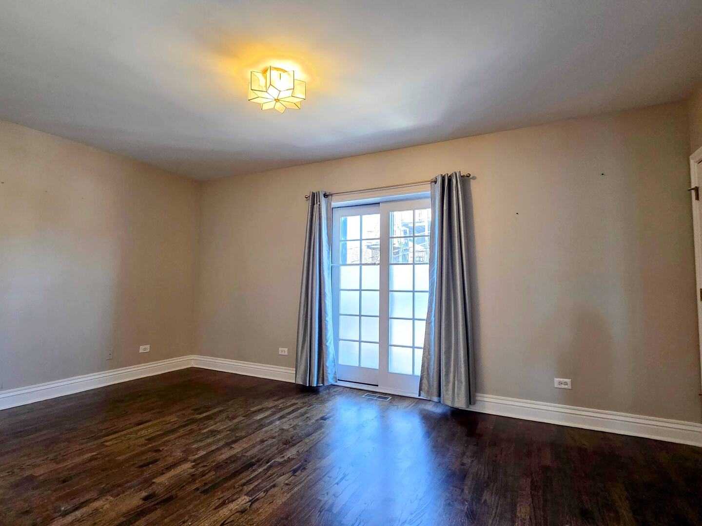 1422 North Noble Street, Unit 2S Chicago, IL 60642 - Photo 7 of 15 a view of empty room with wooden floor and fan