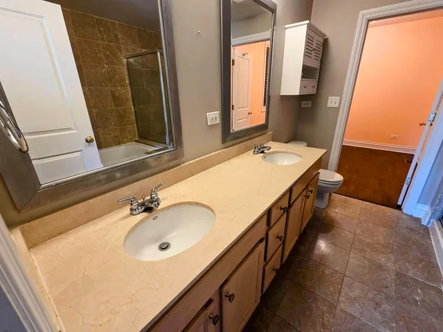 a bathroom with a sink a mirror and a bathtub