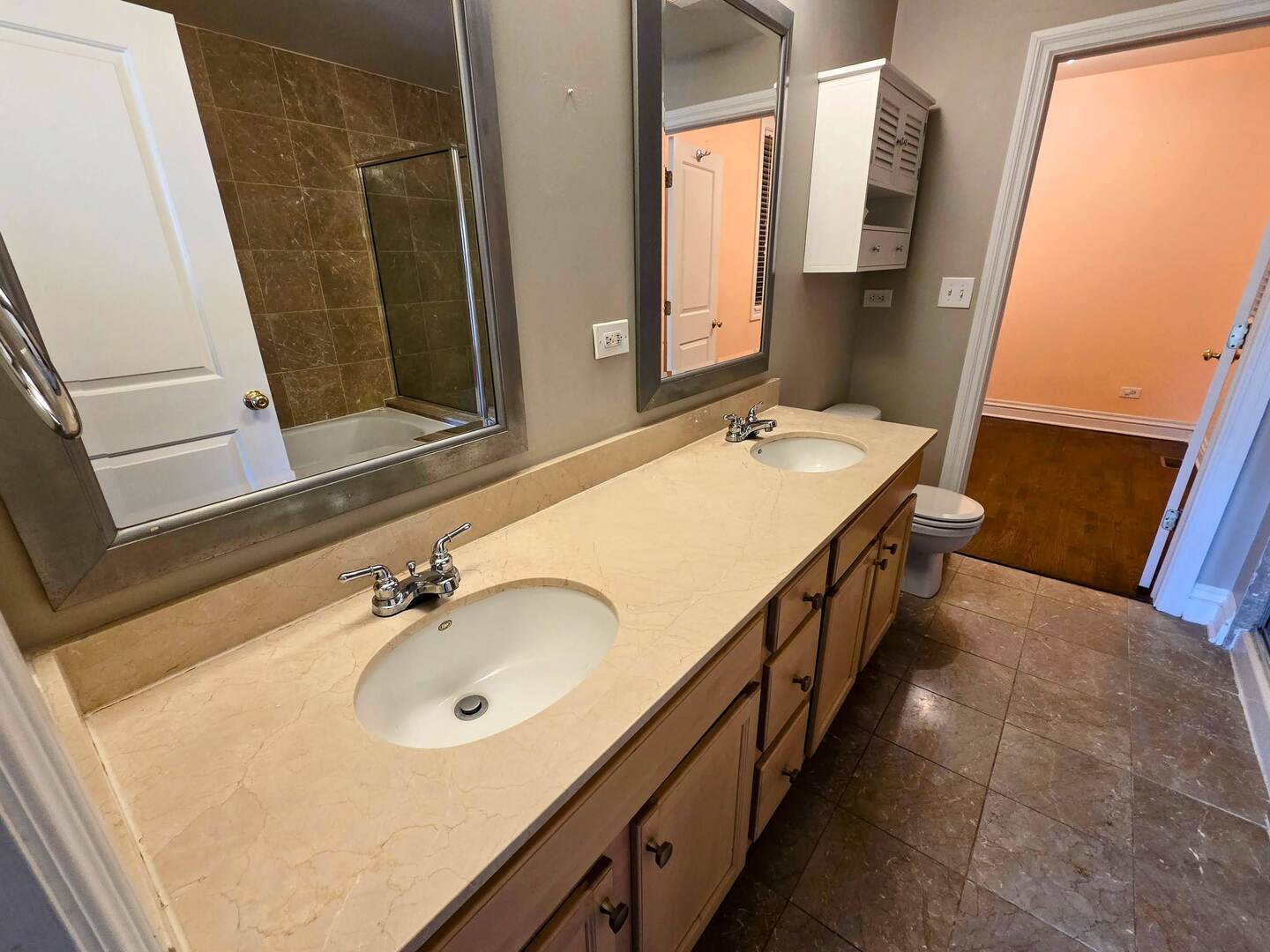 1422 North Noble Street, Unit 2S Chicago, IL 60642 - Photo 10 of 15 a bathroom with a sink a mirror and a bathtub