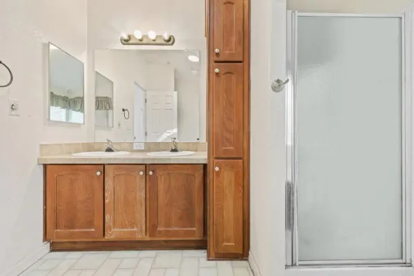 a kitchen with stainless steel appliances granite countertop a refrigerator sink and cabinets