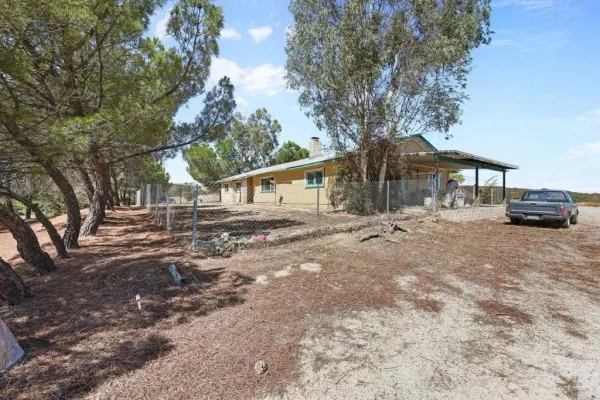 wooden floor in an empty room with a fireplace