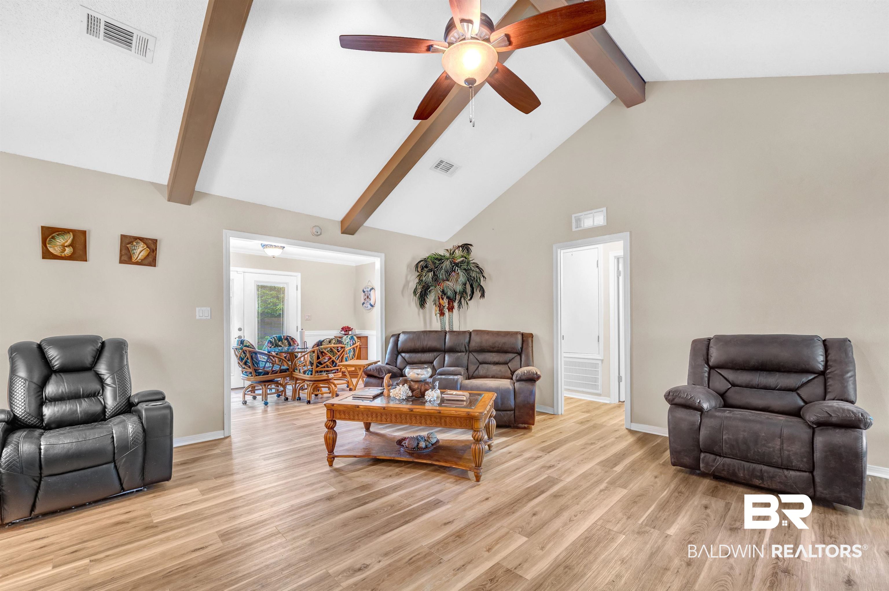24551 Wolf Bay Drive Foley, AL 36535 - Photo 24 of 59 Living area with beamed ceiling, ceiling fan, light wood-style flooring, and high vaulted ceiling