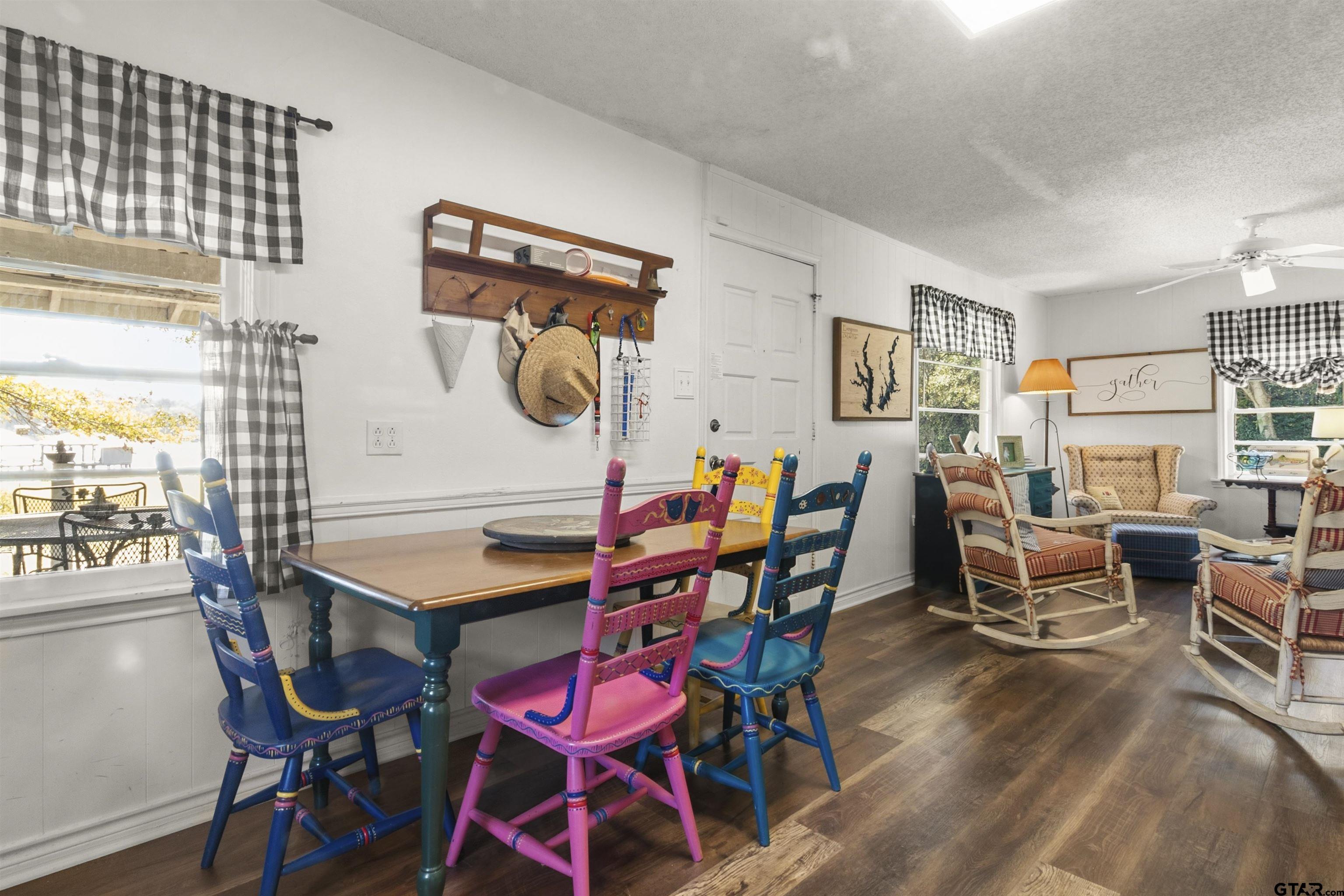 14131 West Peninsula Road Whitehouse, TX 75791 - Photo 12 of 28 a dining room with furniture and wooden floor