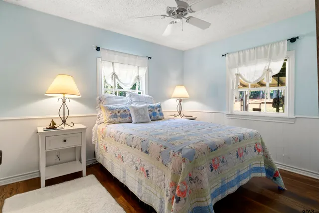 a bedroom with bed and a window