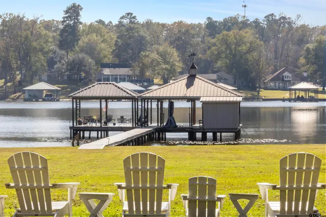 a view of a swimming pool with seating area