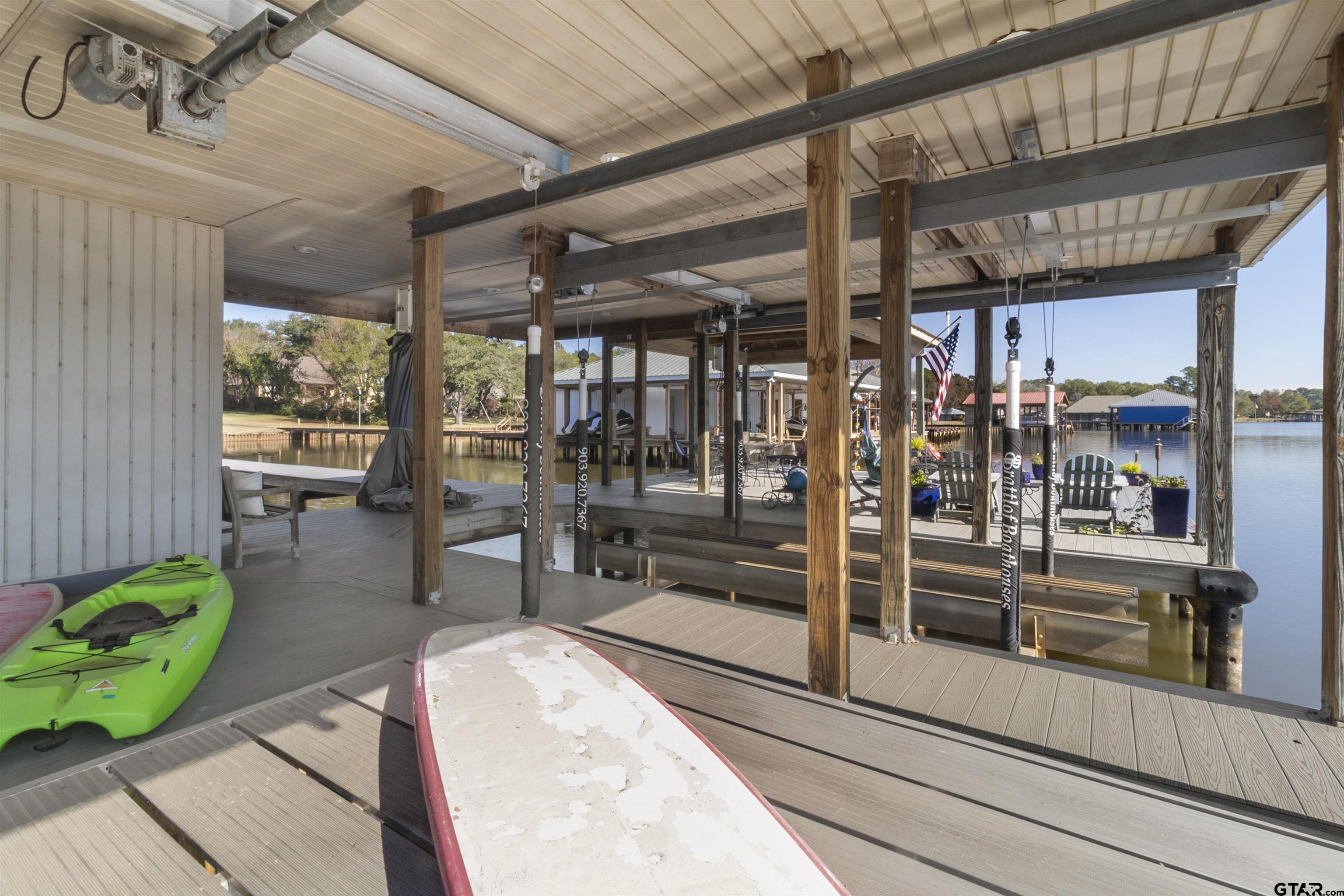 14131 West Peninsula Road Whitehouse, TX 75791 - Photo 24 of 28 a view of a porch with chairs and potted plants