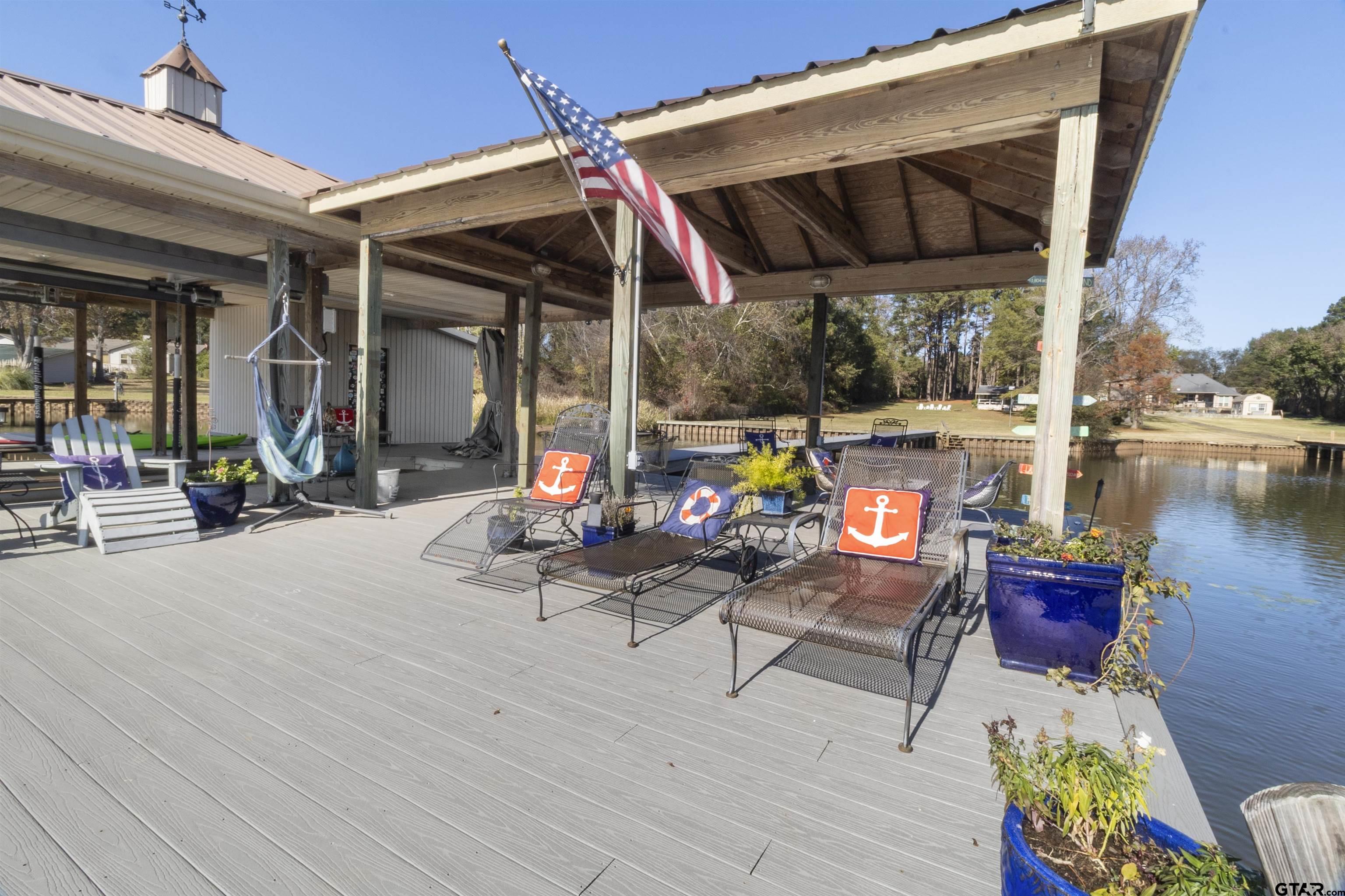 14131 West Peninsula Road Whitehouse, TX 75791 - Photo 25 of 28 a view of a chairs and tables in patio of the house