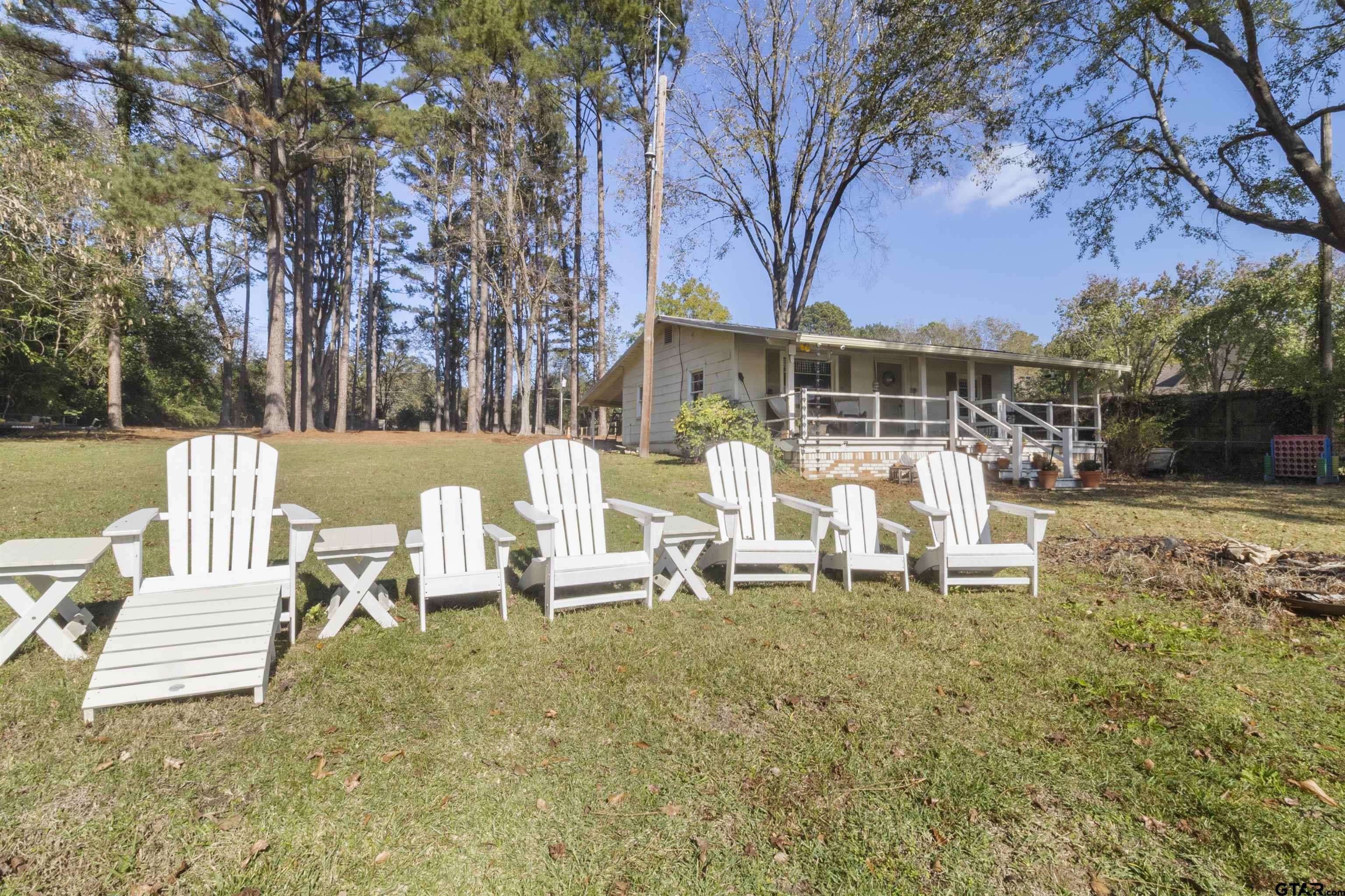 14131 West Peninsula Road Whitehouse, TX 75791 - Photo 6 of 28 a view of a house with backyard porch and sitting area