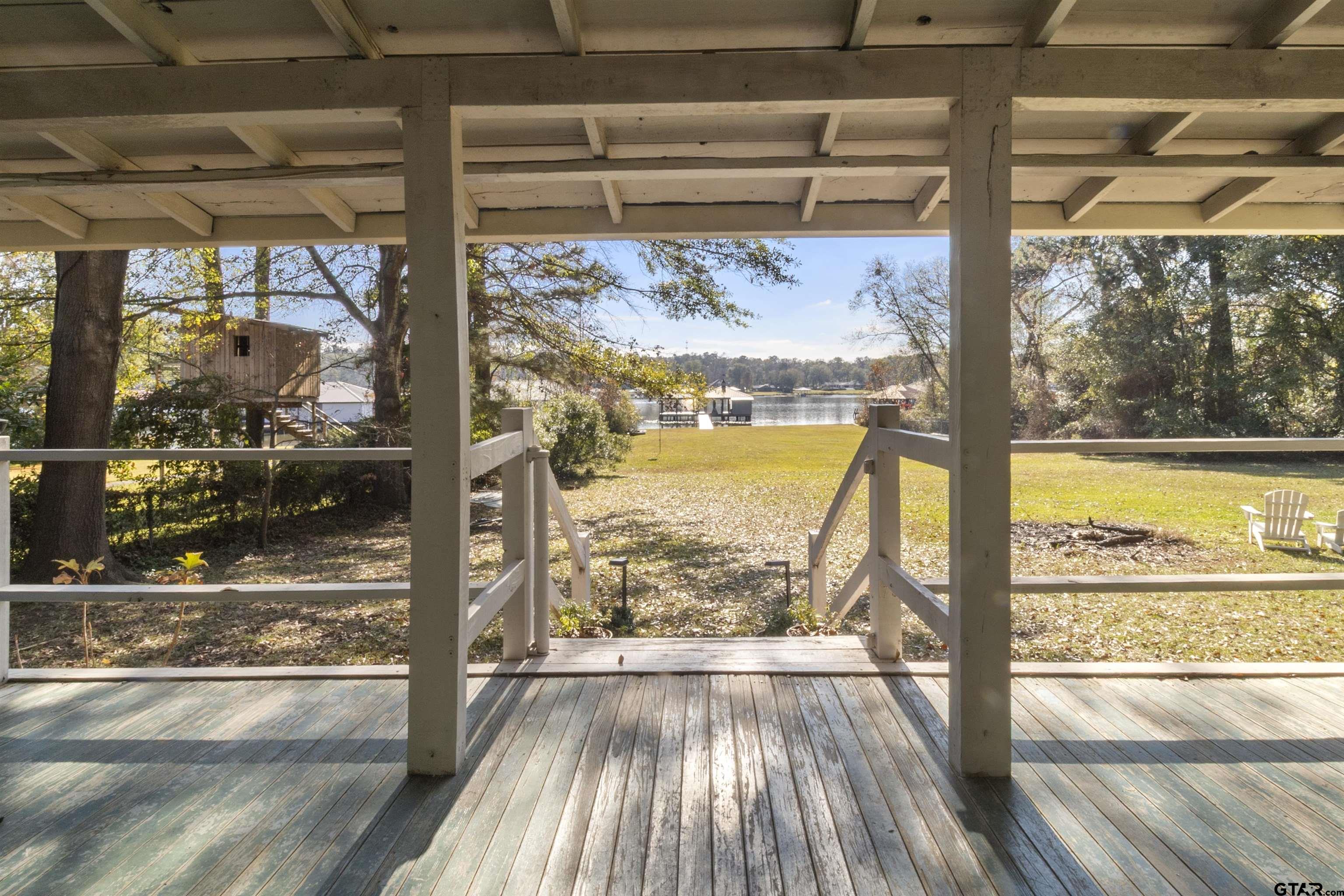14131 West Peninsula Road Whitehouse, TX 75791 - Photo 7 of 28 a view of a room with wooden floor and a window