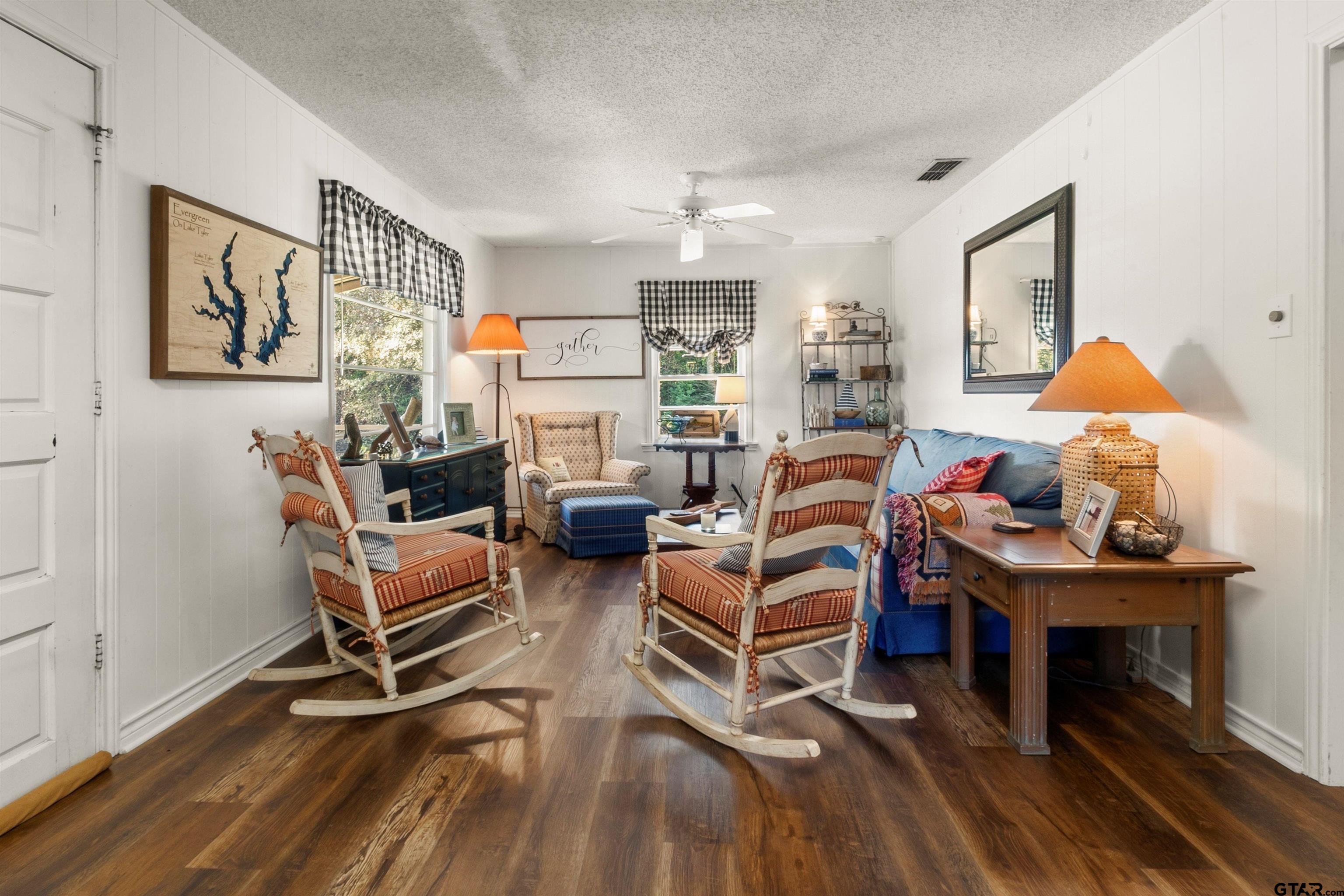 14131 West Peninsula Road Whitehouse, TX 75791 - Photo 8 of 28 a living room with furniture a rug and a table
