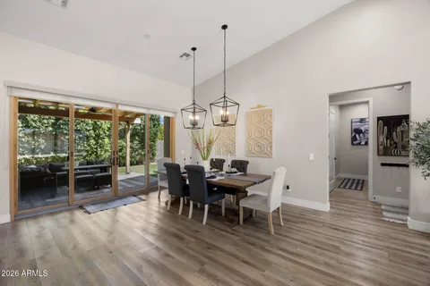 a view of a dining room with furniture window and wooden floor