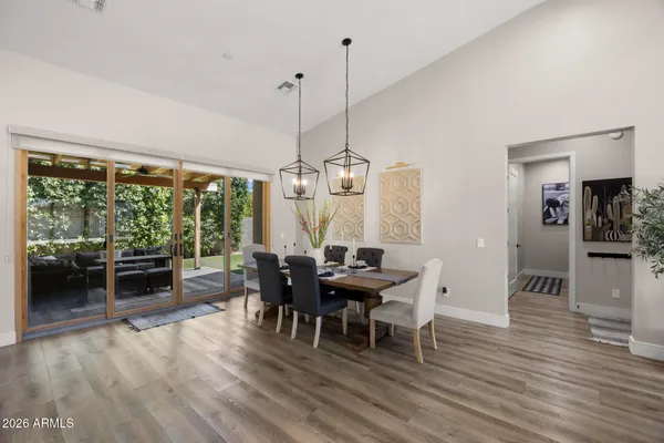 a view of a dining room with furniture window and wooden floor