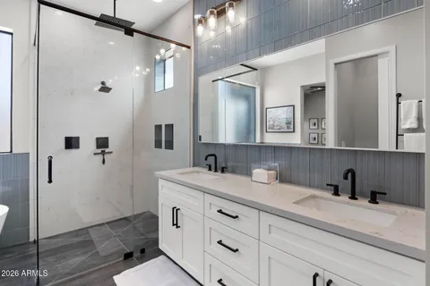 a bathroom with a sink and mirror