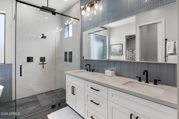 a bathroom with a sink and mirror