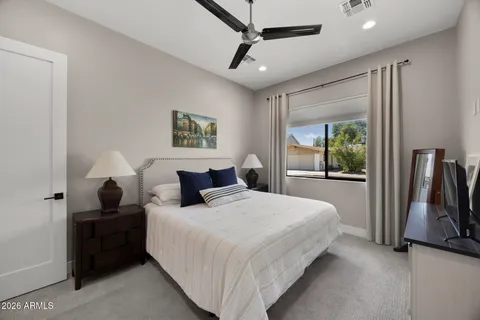 a bedroom with bed and window