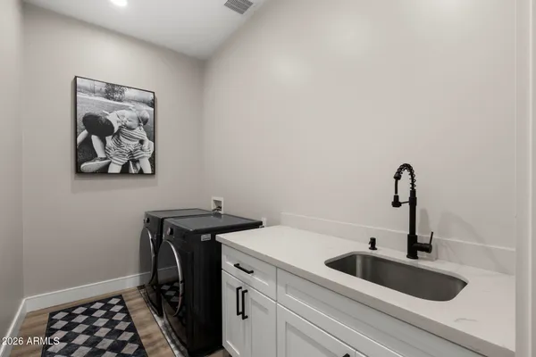 a view of a sink and cabinets