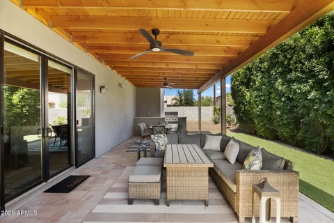 a outdoor space with patio the couches and pool table with chairs