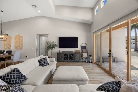 a living room with furniture or couch and a flat screen tv