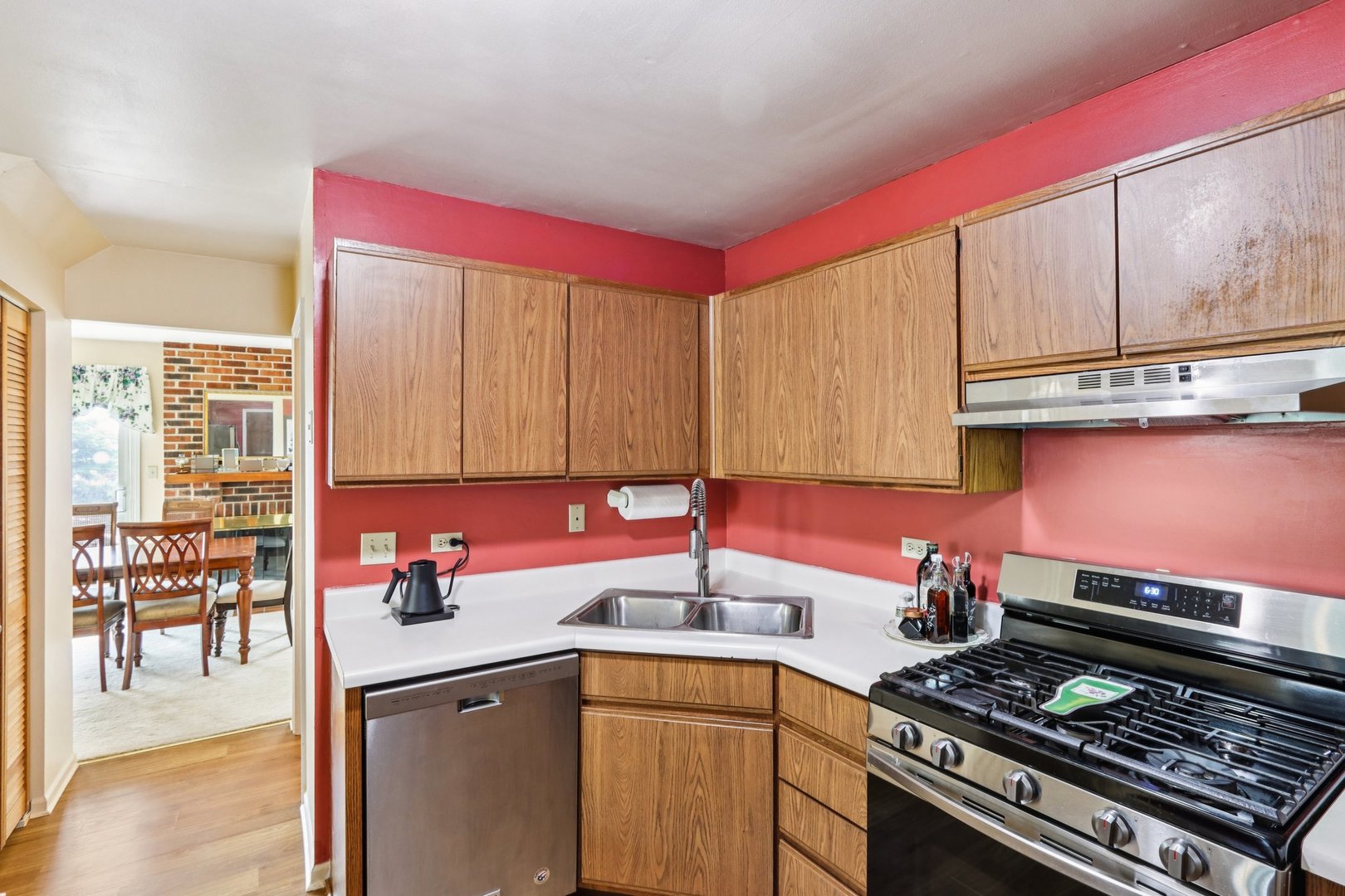 2547 College Hill Circle, Unit 404 Schaumburg, IL 60173 - Photo 12 of 28 a kitchen with a stove a sink and a cabinets