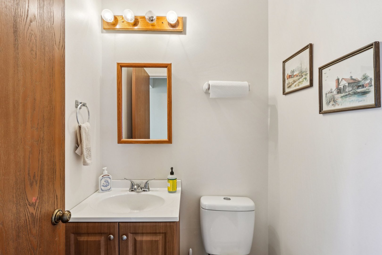 2547 College Hill Circle, Unit 404 Schaumburg, IL 60173 - Photo 13 of 28 a bathroom with a toilet a sink and mirror