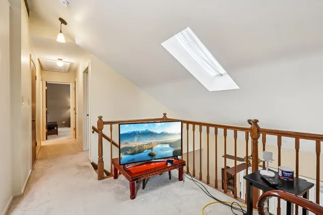 a bathroom with a sink a toilet and shower curtain