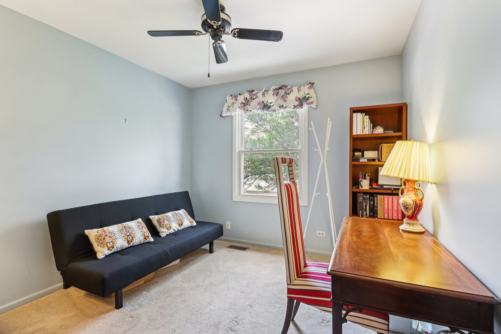 2547 College Hill Circle, Unit 404 Schaumburg, IL 60173 - Photo 16 of 28 a living room with furniture and a window