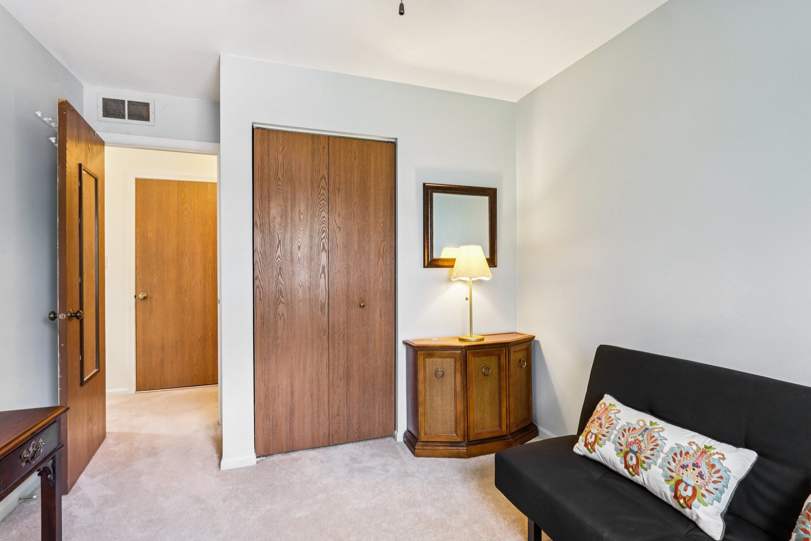 2547 College Hill Circle, Unit 404 Schaumburg, IL 60173 - Photo 17 of 28 a bed room with a bed and a lamp