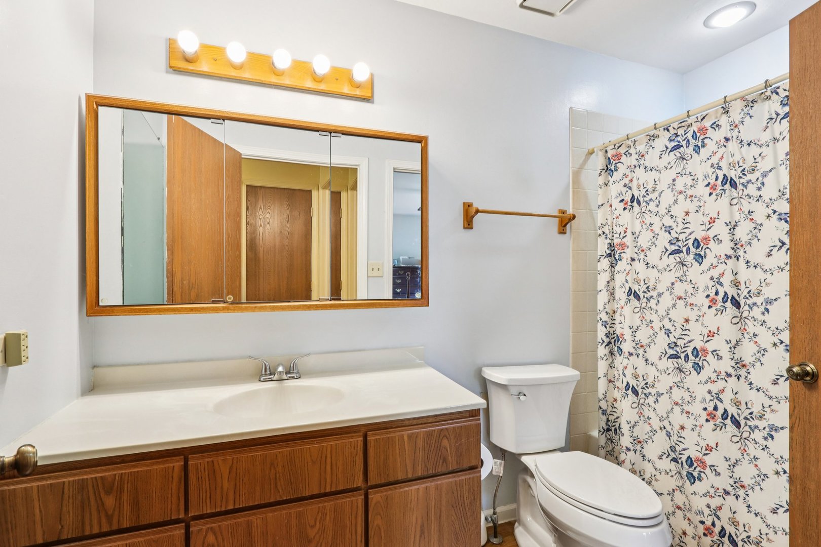 2547 College Hill Circle, Unit 404 Schaumburg, IL 60173 - Photo 18 of 28 a bathroom with a sink a toilet and shower curtain