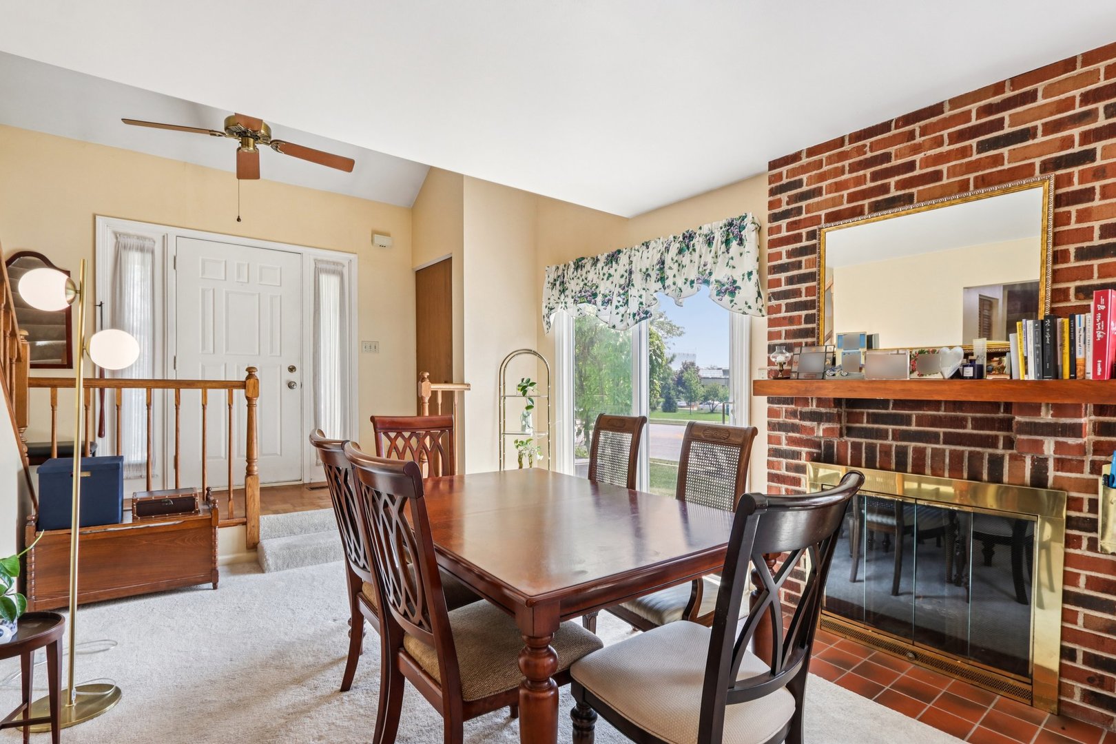 2547 College Hill Circle, Unit 404 Schaumburg, IL 60173 - Photo 2 of 28 a view of a dining room with furniture and wooden floor