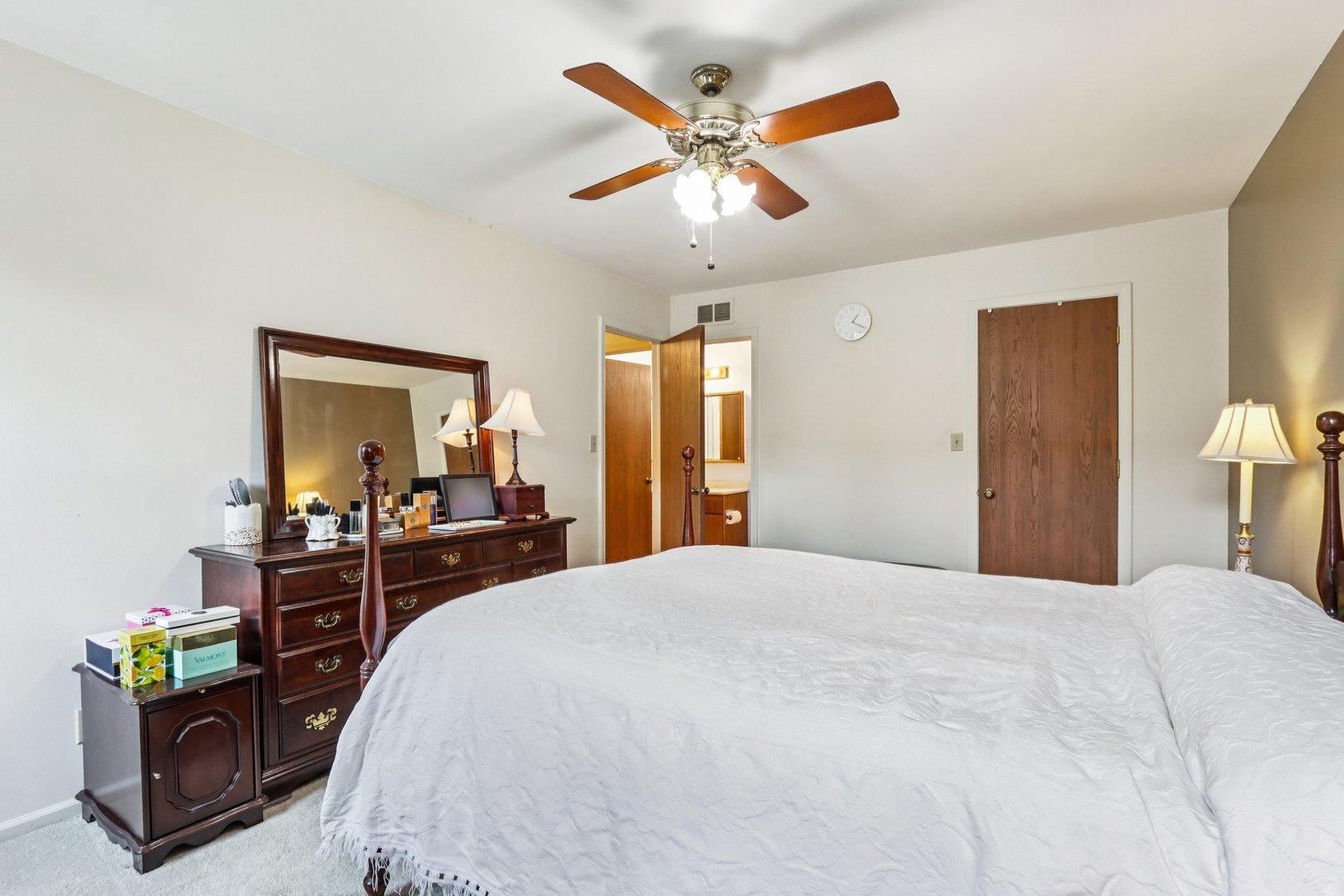 2547 College Hill Circle, Unit 404 Schaumburg, IL 60173 - Photo 22 of 28 a bedroom with a bed and a chandelier