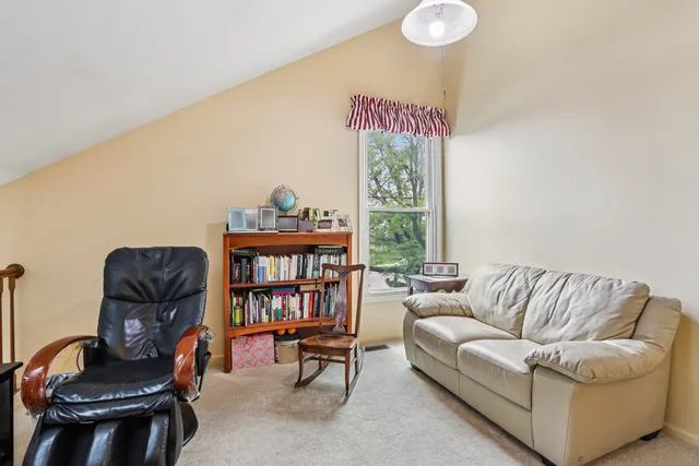 a view of a house with a yard and porch