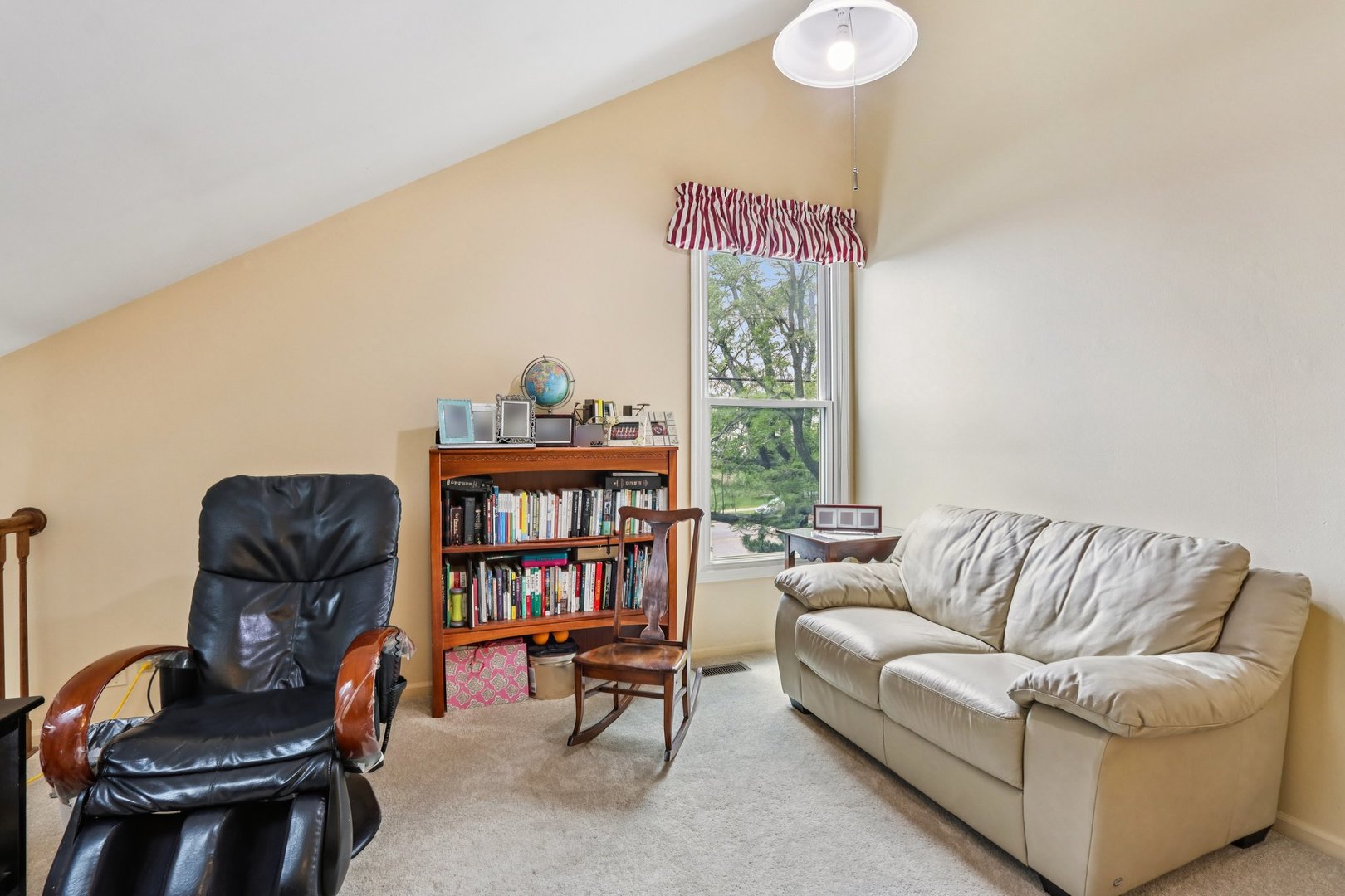 2547 College Hill Circle, Unit 404 Schaumburg, IL 60173 - Photo 23 of 28 a living room with furniture a rug and a book shelf