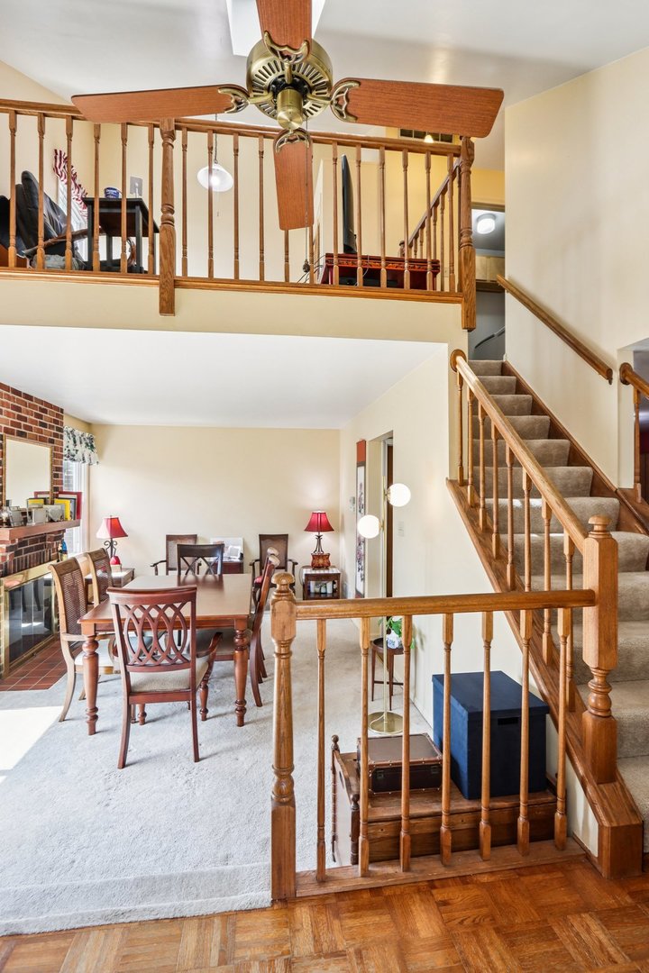 2547 College Hill Circle, Unit 404 Schaumburg, IL 60173 - Photo 6 of 28 a dining room with furniture entryway and wooden floor