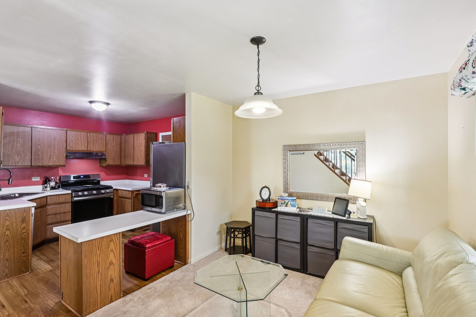 2547 College Hill Circle, Unit 404 Schaumburg, IL 60173 - Photo 9 of 28 a kitchen with stainless steel appliances kitchen island granite countertop a stove and a refrigerator